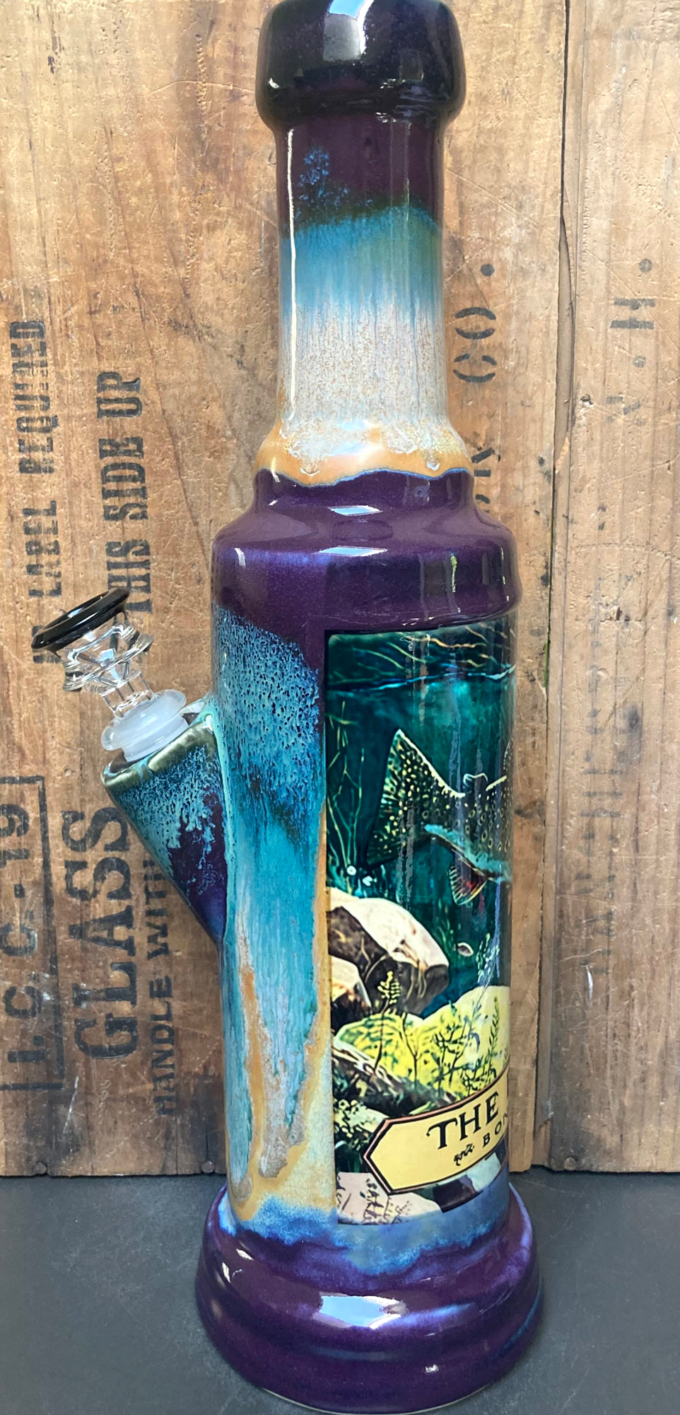 Ceramic bong with trout fish river design featuring vibrant colors and artistic detailing
