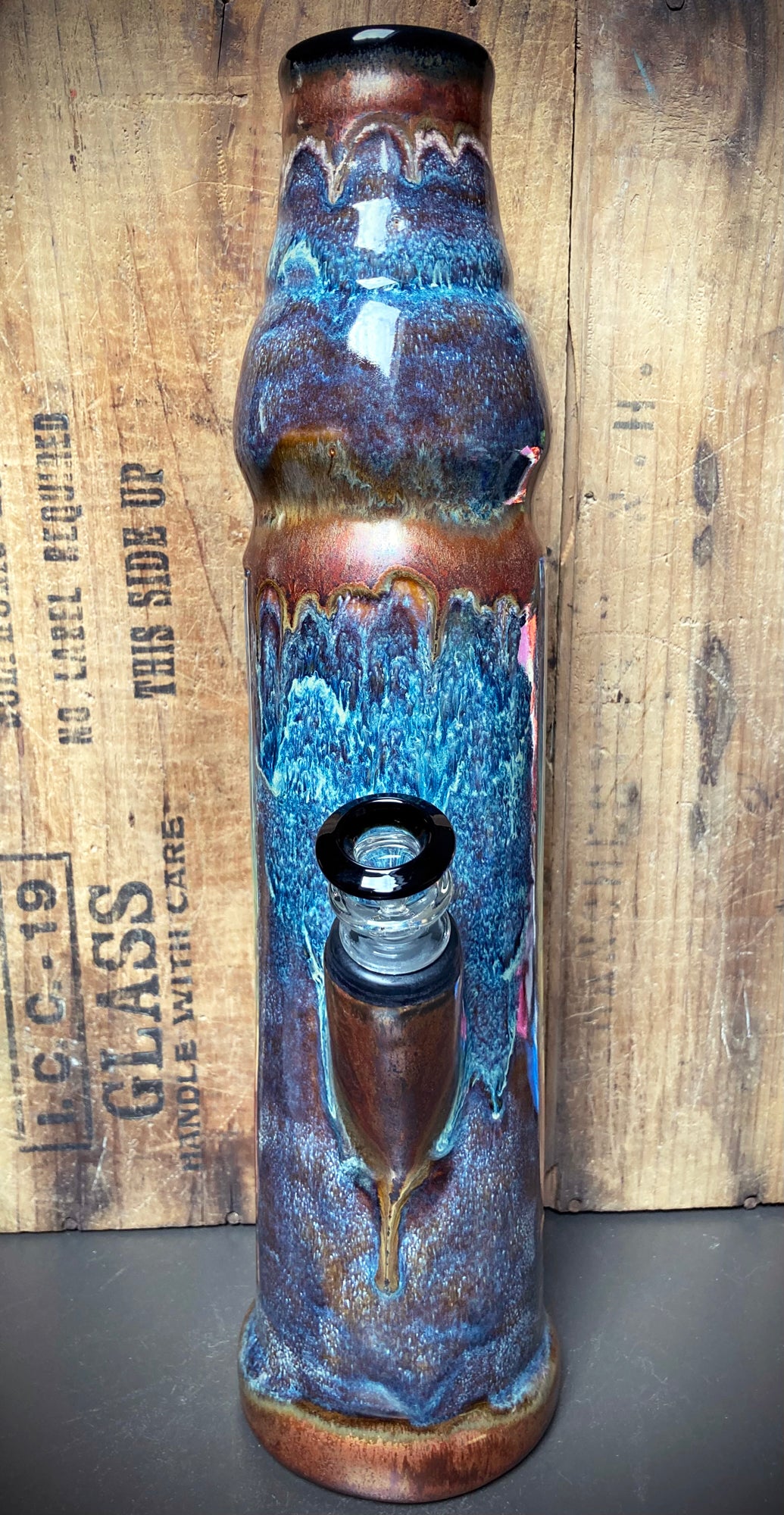 Unique ceramic dragon bong with intricate blue and brown designs for a stylish smoking experience