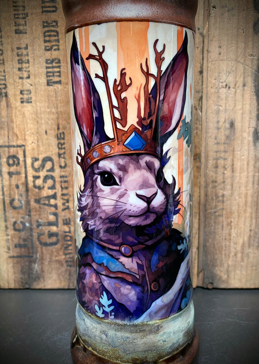 Cute bunny in forest scene on ceramic bong, wearing a gold crown.