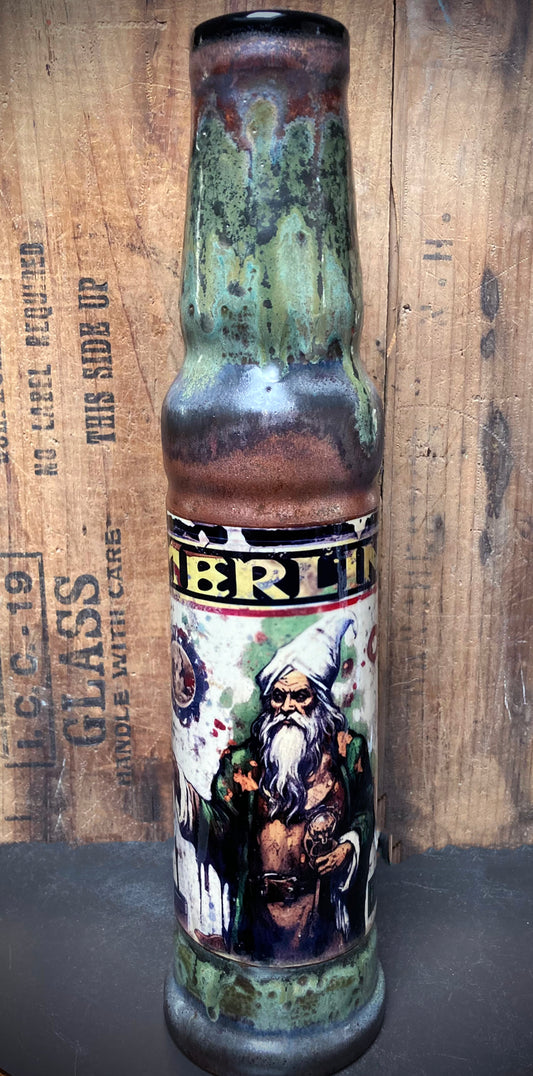 Fantasy-style ceramic bong showing Merlin in copper and green finish.