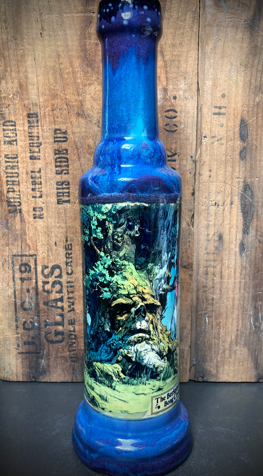Close up of detailed tree spirit illustration, weathered bark and leafy greens.