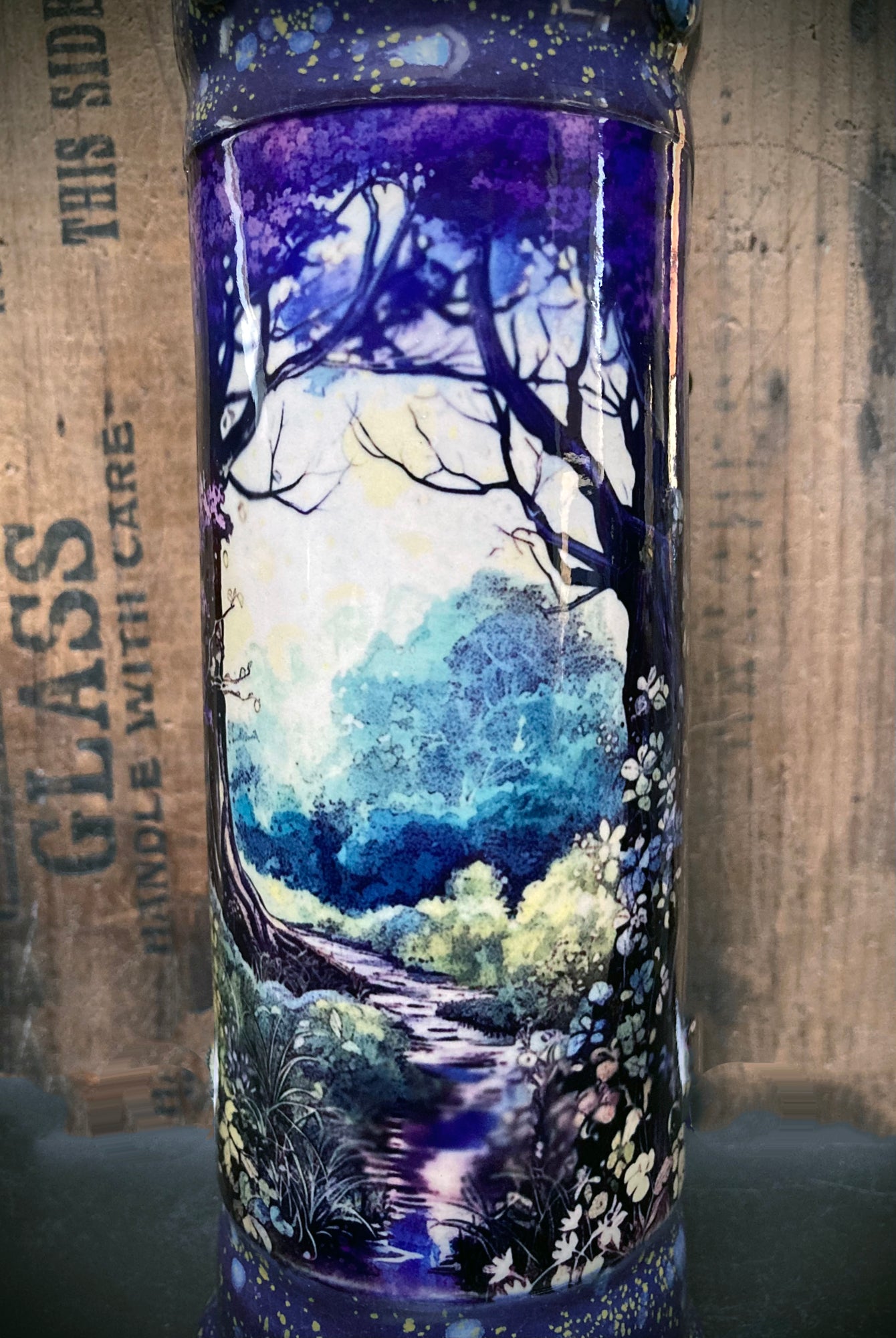 Serene woodland path through trees featured on handmade ceramic bong.