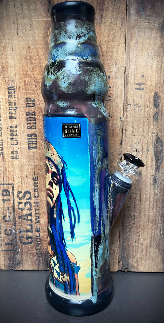 Handmade ceramic bong featuring tribal star seed warrior in blue and silver glaze.