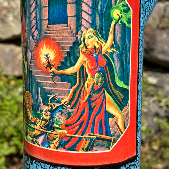 Handmade ceramic bong featuring classic Dungeons & Dragons red rulebook artwork, blue crackle glaze and glossy black accents.