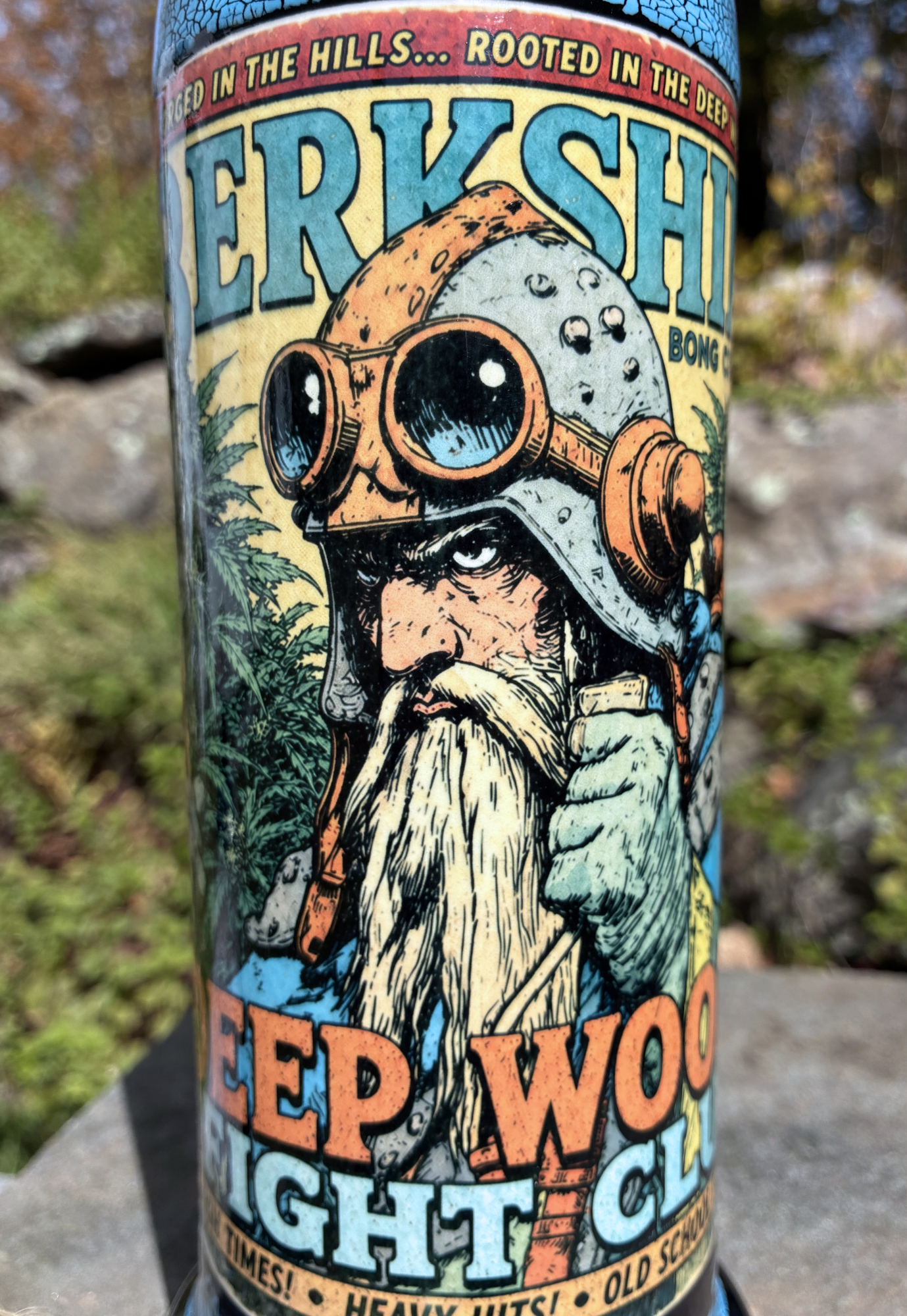 Deep Woods Fight Club handmade ceramic bong featuring vintage bearded woodsman comic artwork, bright blue crackle glaze and glossy black accents.