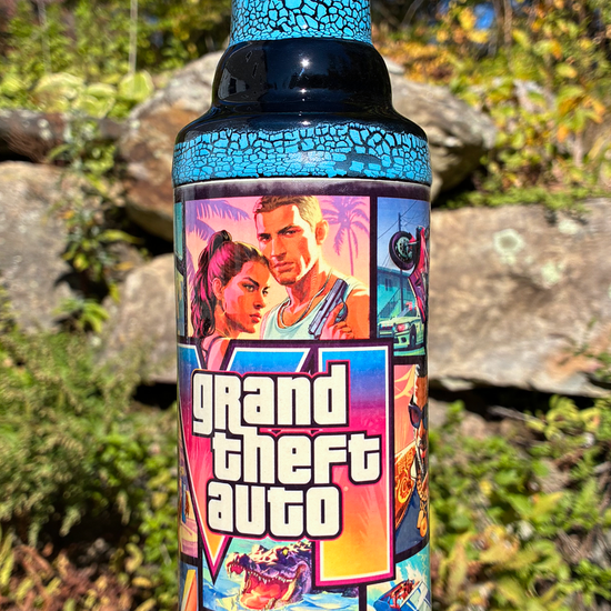 Handmade ceramic bong with GTA VI-inspired collage artwork, blue crackle glaze and glossy black accents.
