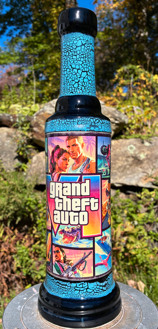 Handmade ceramic bong with GTA VI-inspired collage artwork, blue crackle glaze and glossy black accents.