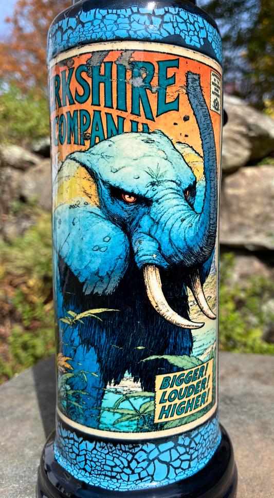 The Mighty Elephant handmade ceramic bong featuring vintage elephant comic-cover artwork, bright blue crackle glaze and glossy black accents.