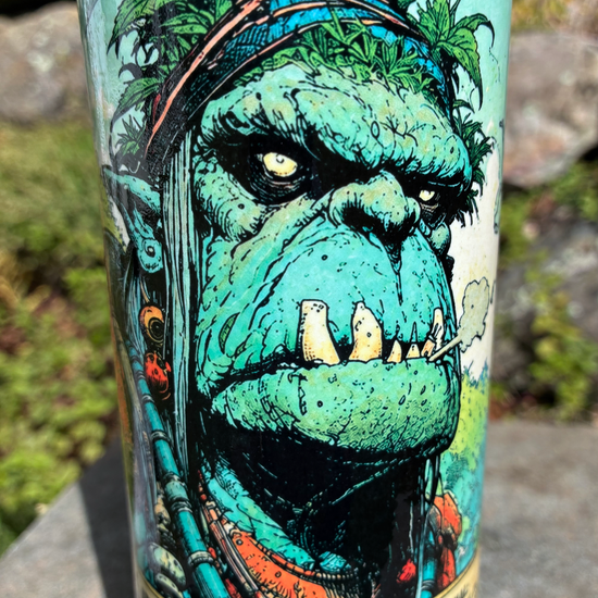 Berkshire Hills Shaman handmade ceramic bong featuring green orc collectible-card artwork, bright blue crackle glaze and glossy black accents.