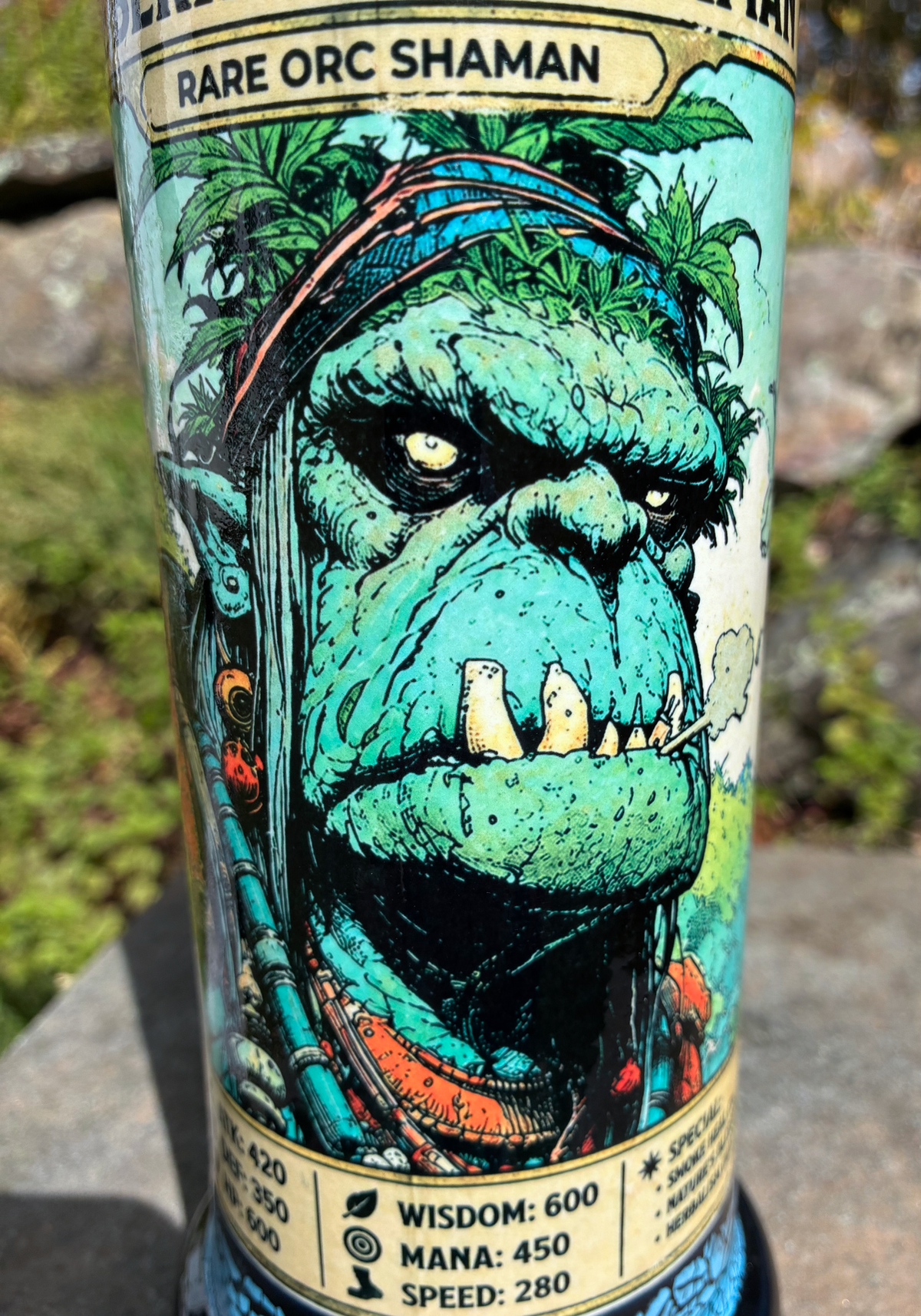 Berkshire Hills Shaman handmade ceramic bong featuring green orc collectible-card artwork, bright blue crackle glaze and glossy black accents.