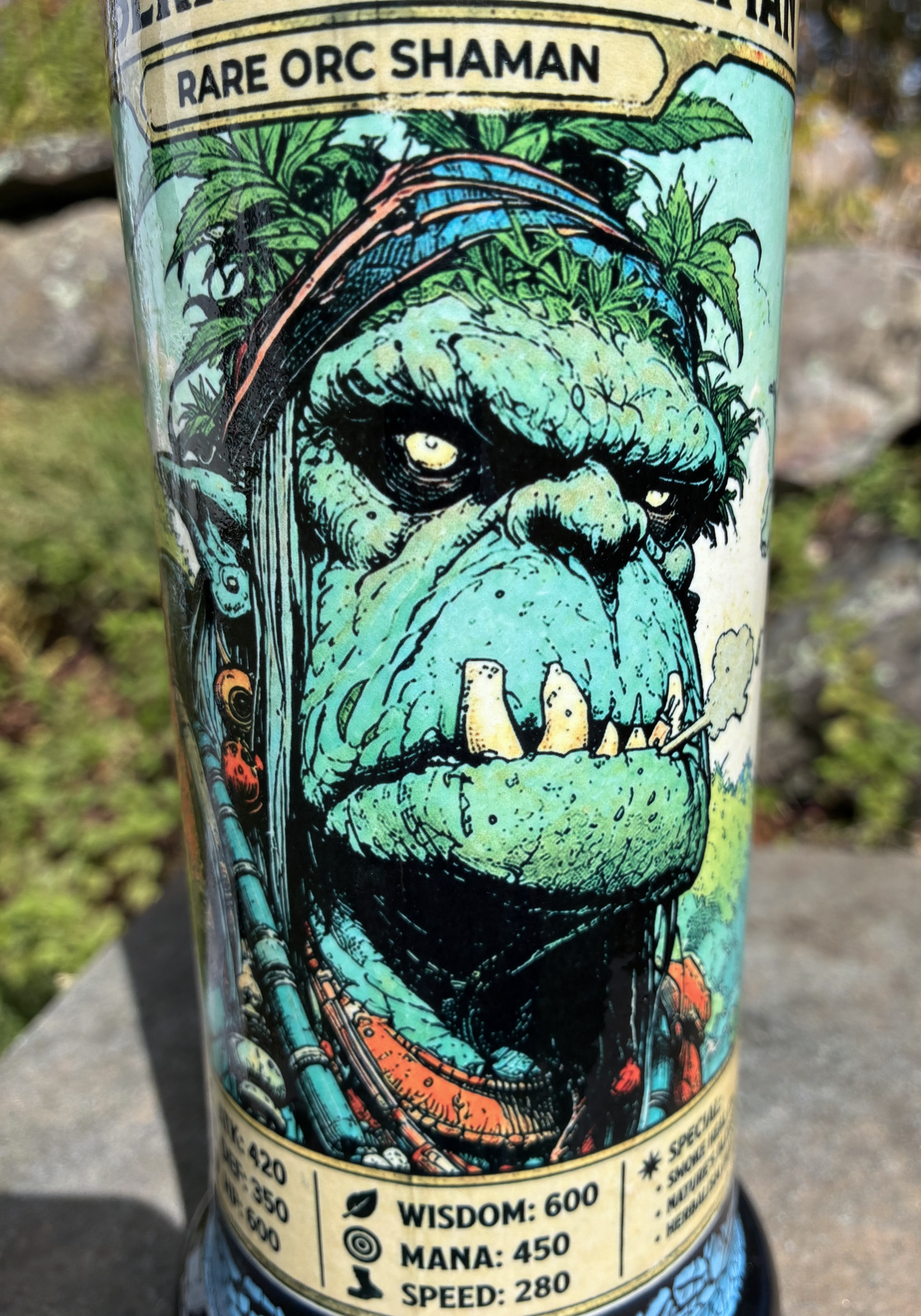 Berkshire Hills Shaman handmade ceramic bong featuring green orc collectible-card artwork, bright blue crackle glaze and glossy black accents.