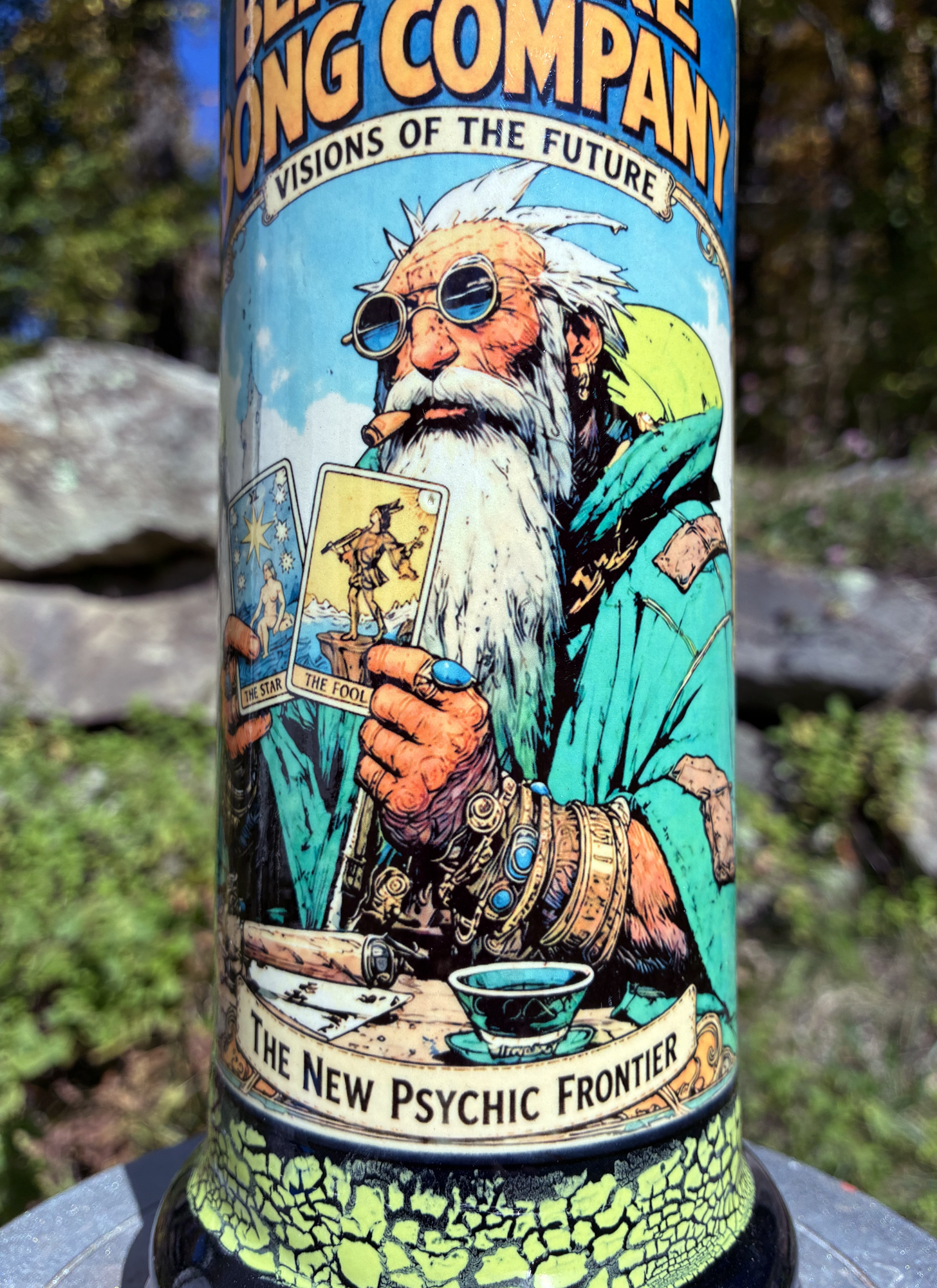 Handmade ceramic bong featuring a wise old tarot reader holding The Star and The Fool, with yellow-green glaze and glossy black accents