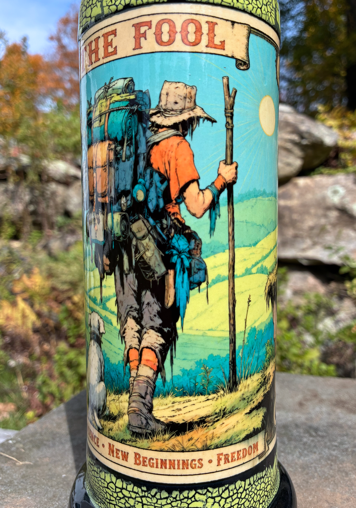The Fool handmade ceramic tarot bong featuring a backpacking traveler and dog, neon yellow-green crackle glaze and glossy black accents.