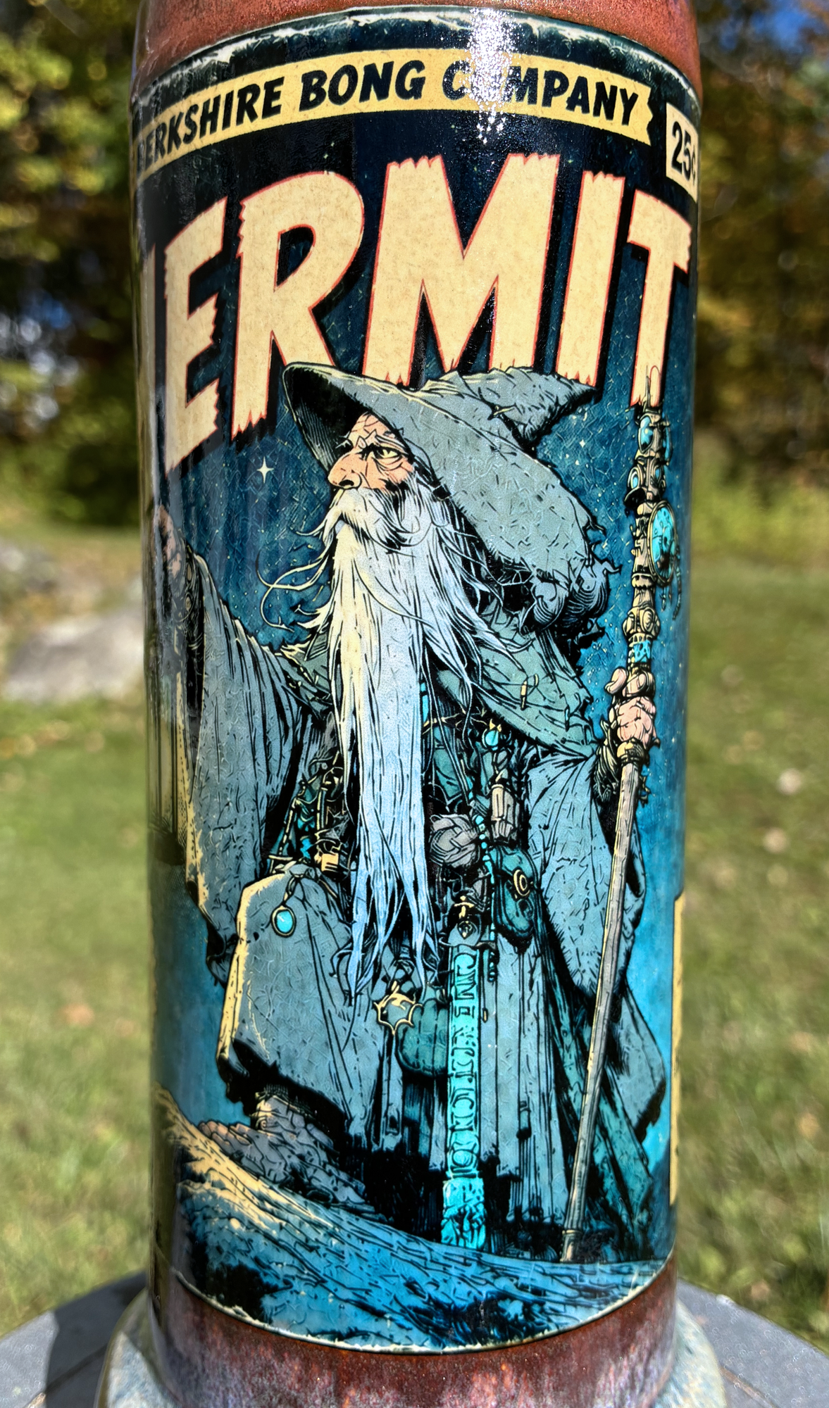 The Hermit handmade ceramic tarot bong featuring lantern-bearing wanderer artwork, smoky grey and lavender glaze, and metallic copper accents.