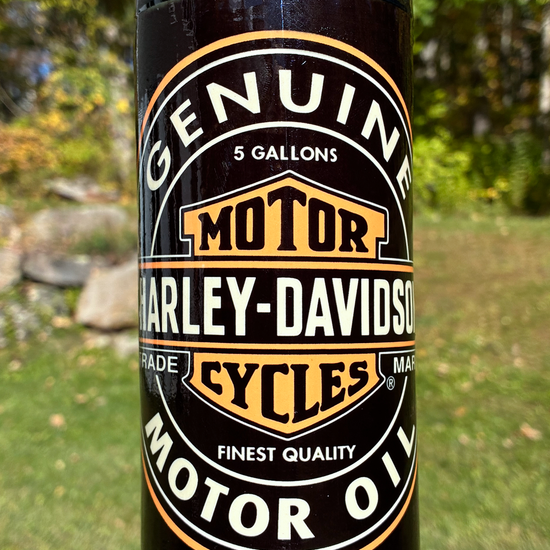 Handmade ceramic bong featuring vintage Harley-Davidson oil-can artwork, red crackle glaze and glossy black accents.
