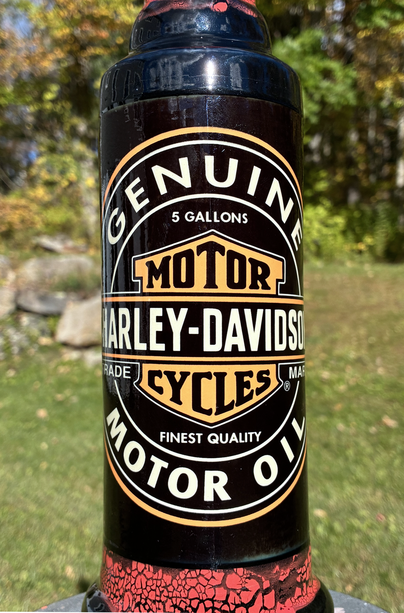 Handmade ceramic bong featuring vintage Harley-Davidson oil-can artwork, red crackle glaze and glossy black accents.