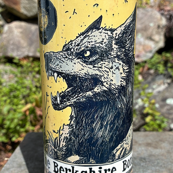 Handmade ceramic wolf bong featuring vintage woodcut-style wolf artwork against a golden yellow sky, red crackle glaze and glossy black accents.