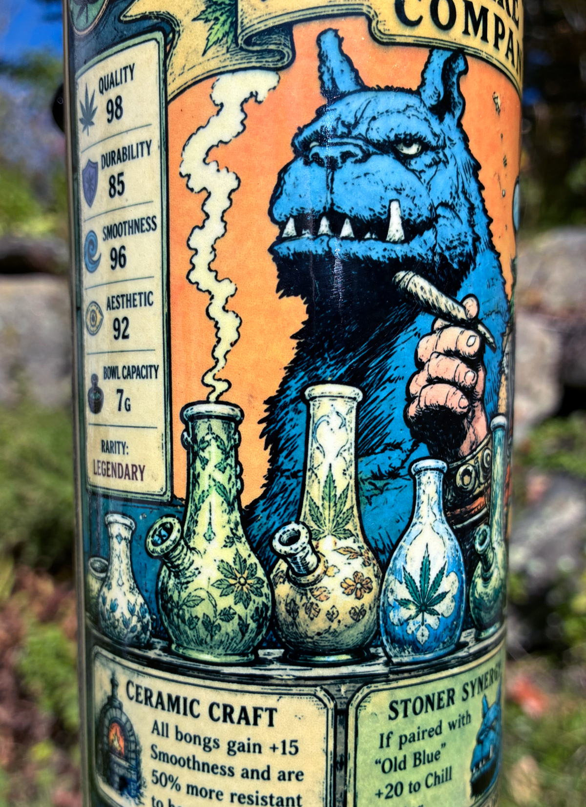 Old Blue and the Bong Maker handmade ceramic bong featuring fantasy collector-card artwork, yellow and copper glaze, and glossy dark accents