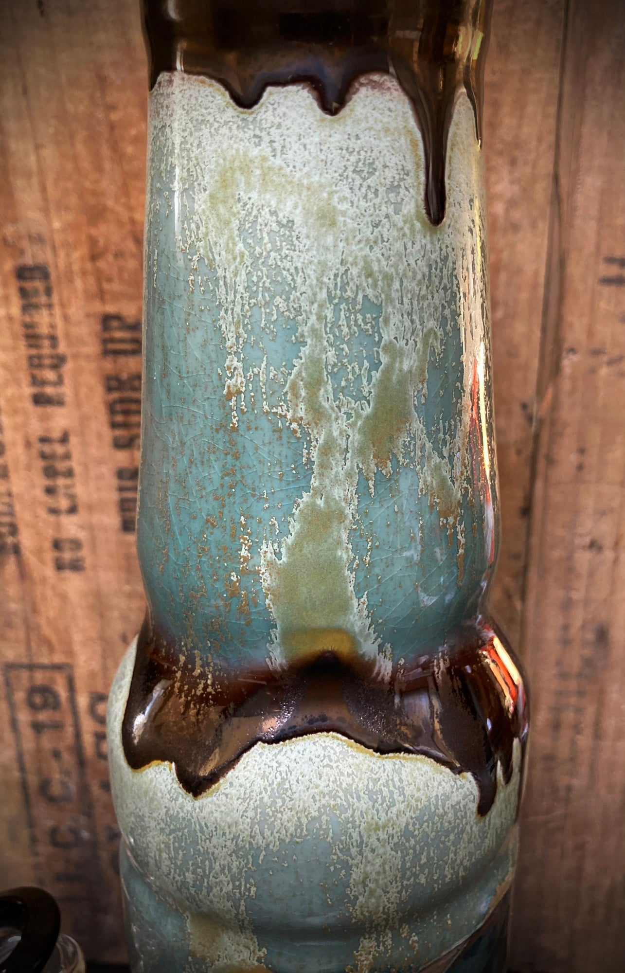 Elegant goddess of the waters on ceramic bong in green and gold finish.