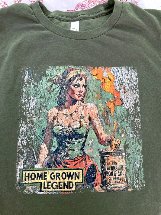 Homegrown Legend Distressed Art Military Green T-Shirt featuring vintage distressed pinup artwork of a woman with jar and flame
