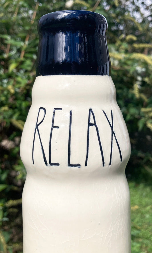 Stoneware Farmhouse Ceramic Bong RELAX cream stoneware bong with navy rim and hand painted RELAX lettering outdoors