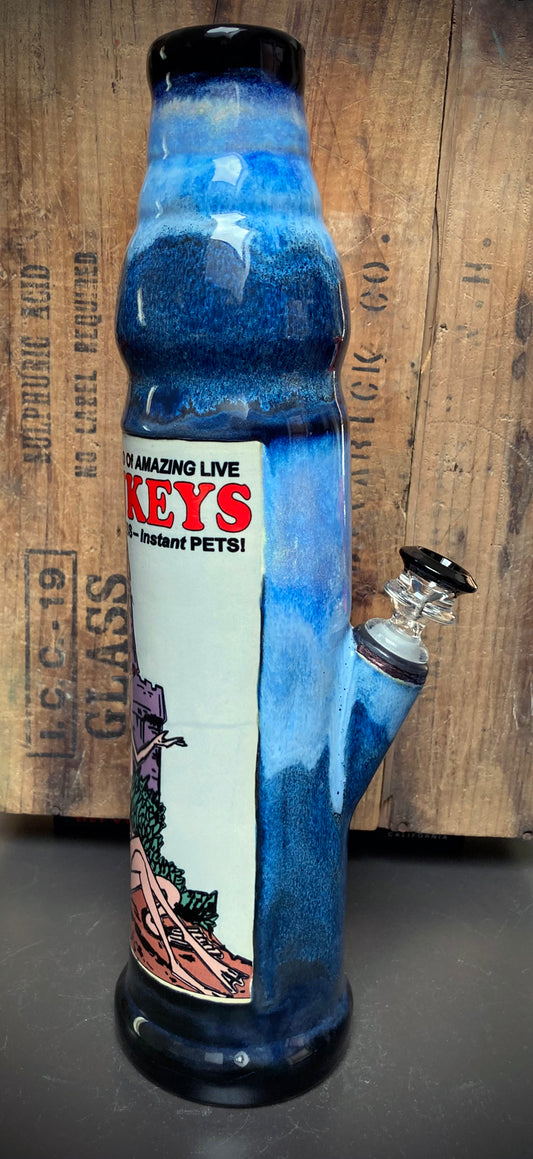 Handmade ceramic bong with retro comix-style Sea Monkey artwork in blue tones.